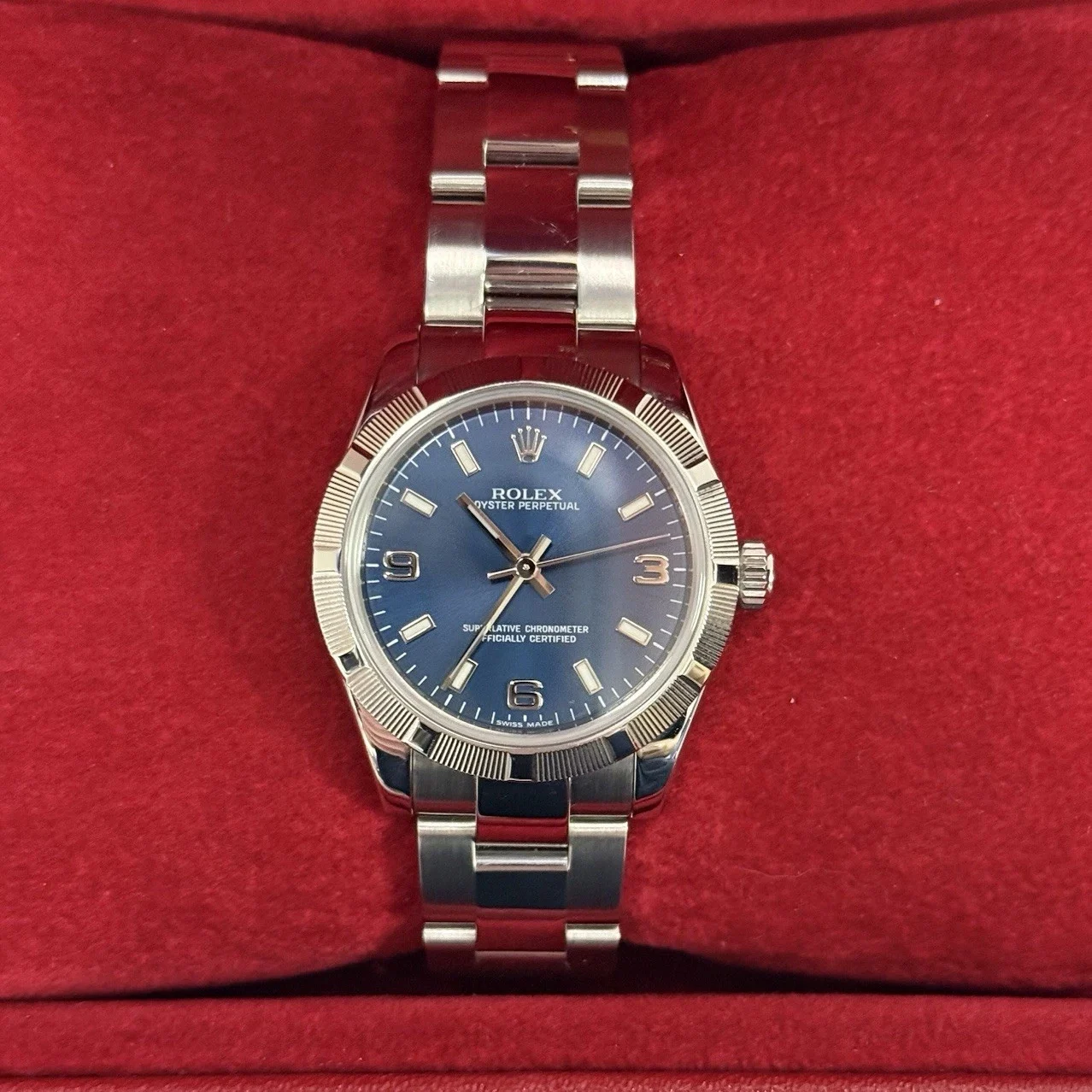 Rolex Oyster Perpetual 31 Steel / Engine-Turned / Blue / Arabic / Oyster 177210