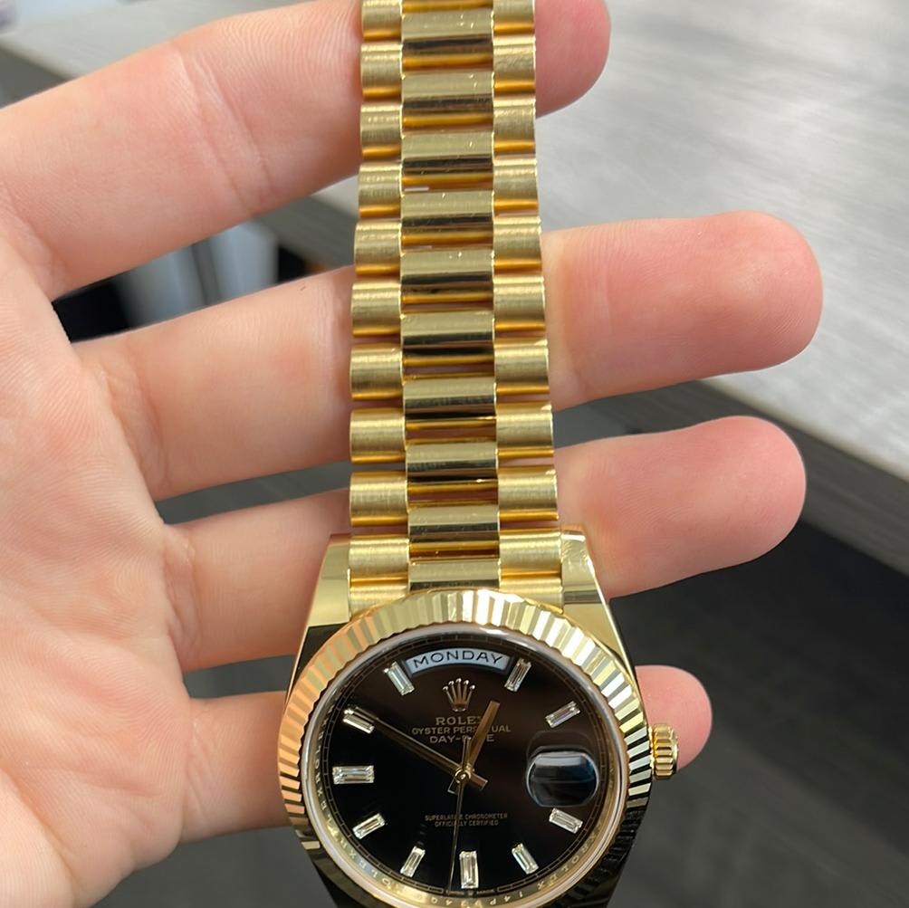 Rolex day date 40 hot sale yellow gold black dial